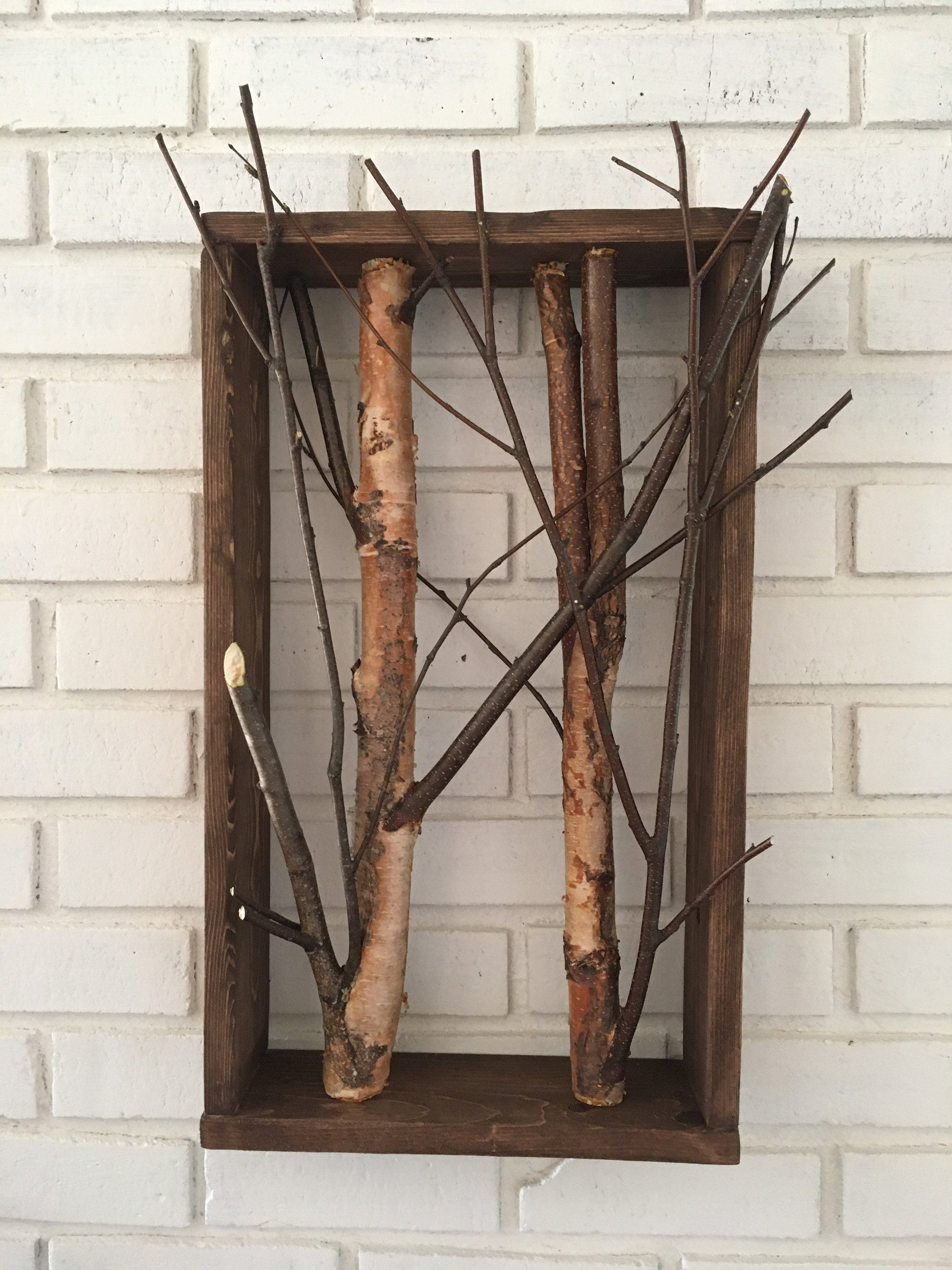 Birch branch shadow box wall decor featuring natural textures and earthy tones, perfect for adding a rustic touch to any interior space