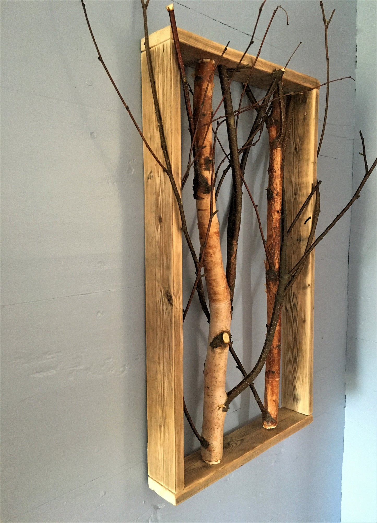 Birch branch shadow box wall decor featuring natural textures and earthy tones, perfect for adding a rustic touch to any interior space
