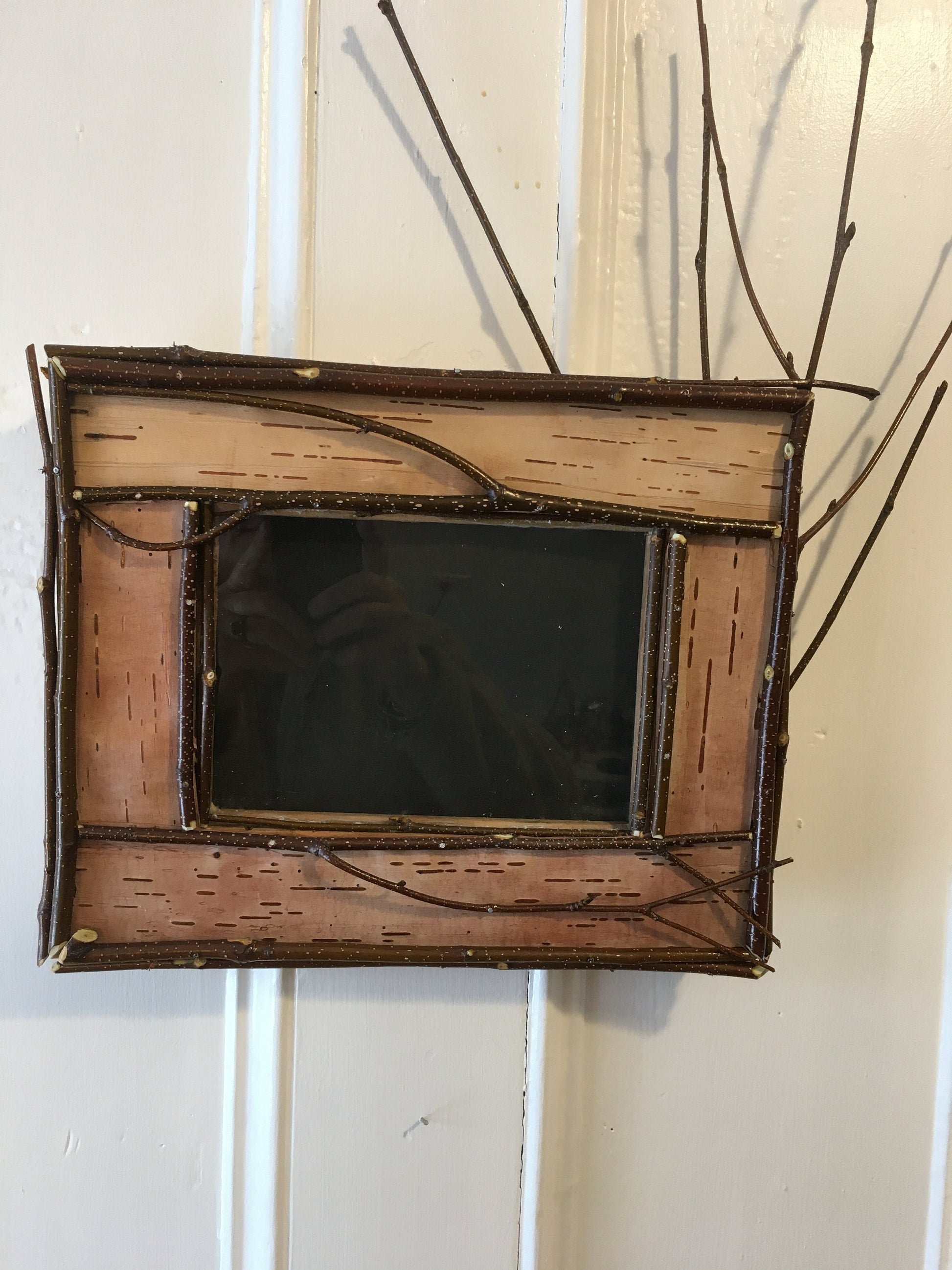 Adirondack picture frame crafted from birch bark and twigs, featuring natural textures and earthy tones, perfect for showcasing your favorite photo in a rustic, nature-inspired style, inspired by nature