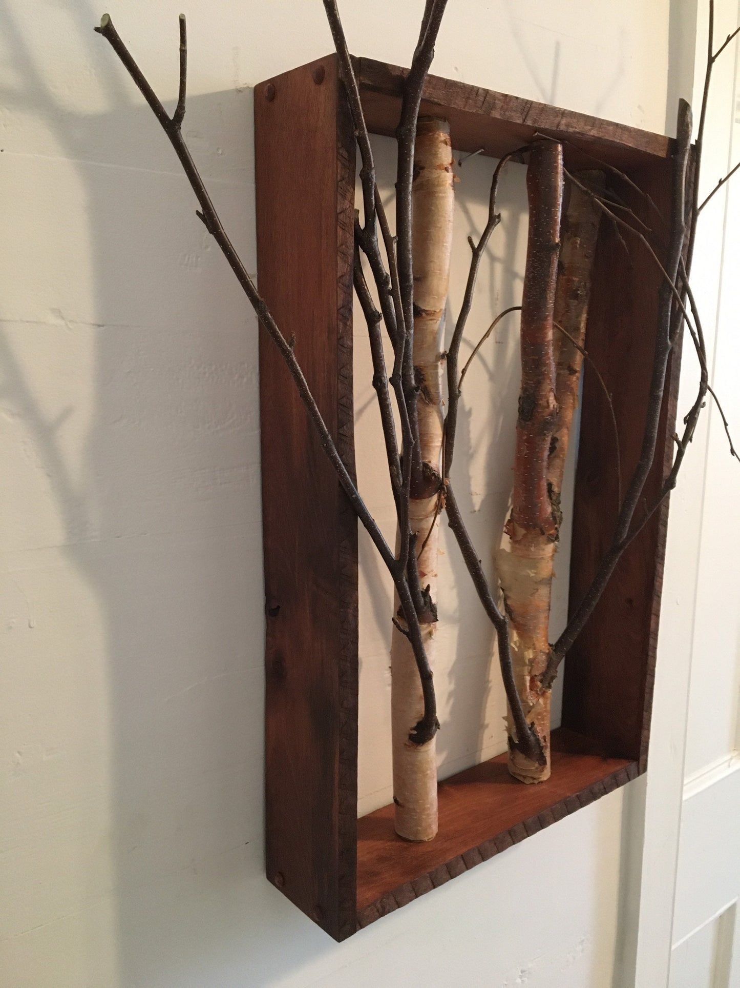 Birch branch shadow box wall decor featuring natural textures and earthy tones, perfect for adding a rustic touch to any interior space
